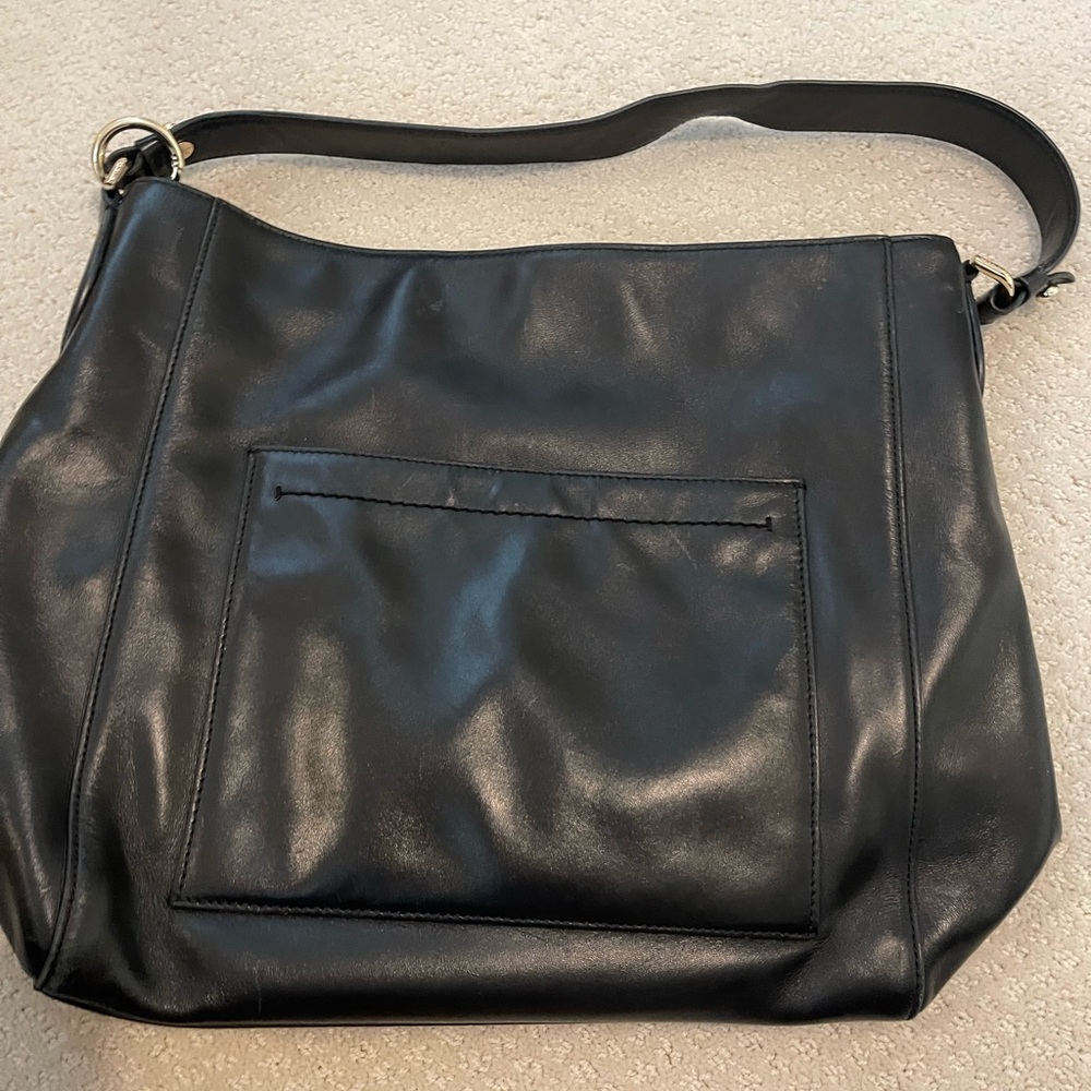 Cole Haan black leather shoulder bag.